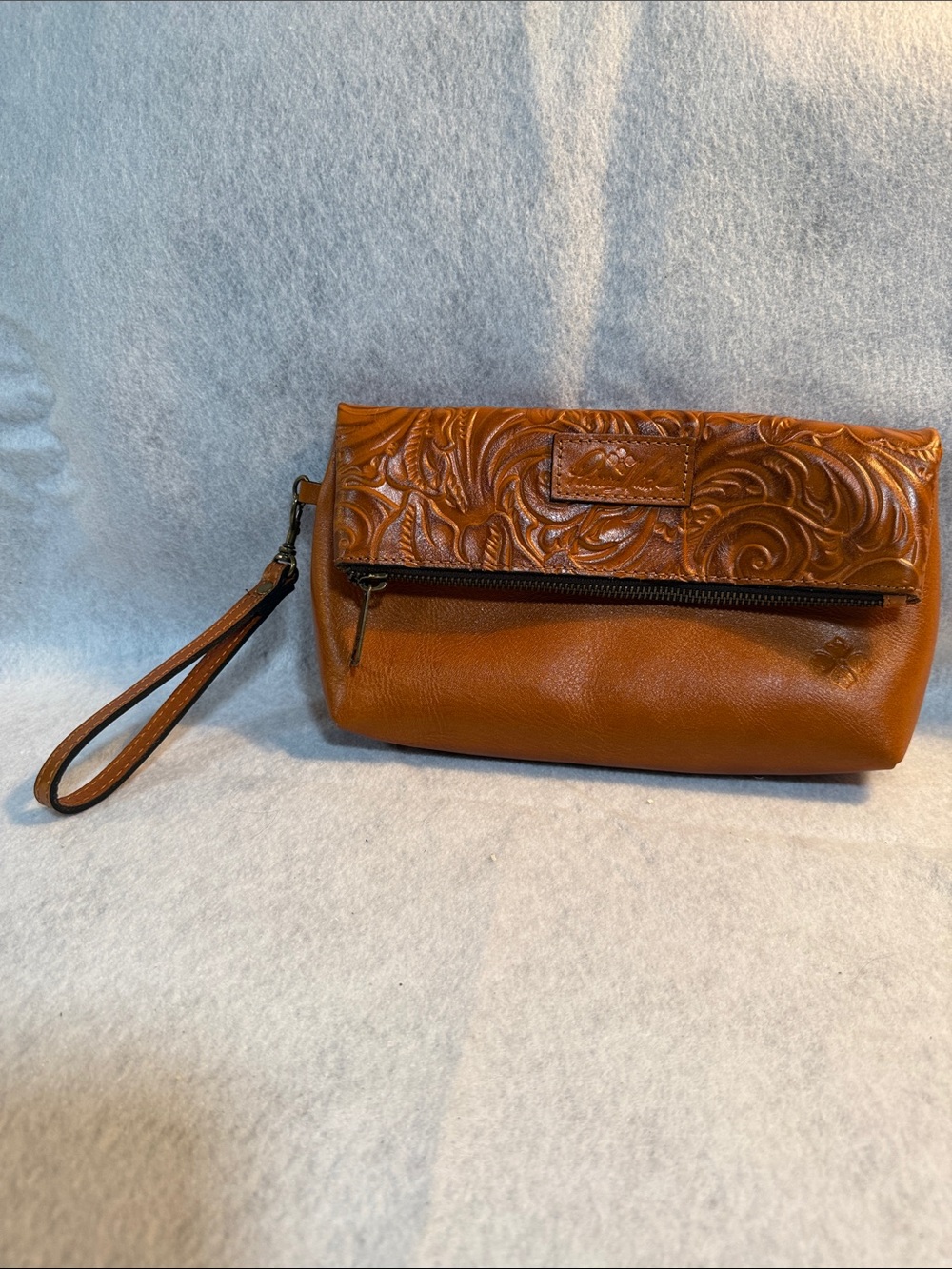 Patricia Nash Tooled Floral Leather Wristlet in Cognac Brown